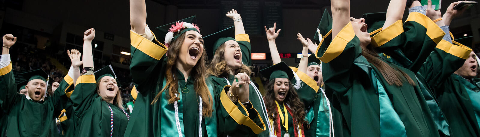 photo of happy graduates at a wright state commencement ceremony